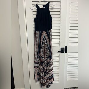 Floor length dress. Design on the bottom half of the dress and solid on the top